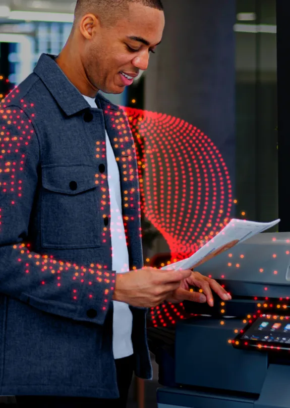 Man standing by Sharp MFP